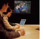 Employees viewing a video in a conference room