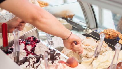 person scooping ice cream - get the scoop on how to promote adoption of social media